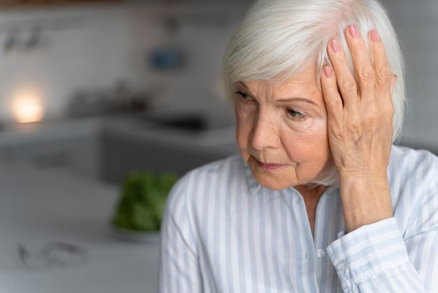 Senior woman holding her head